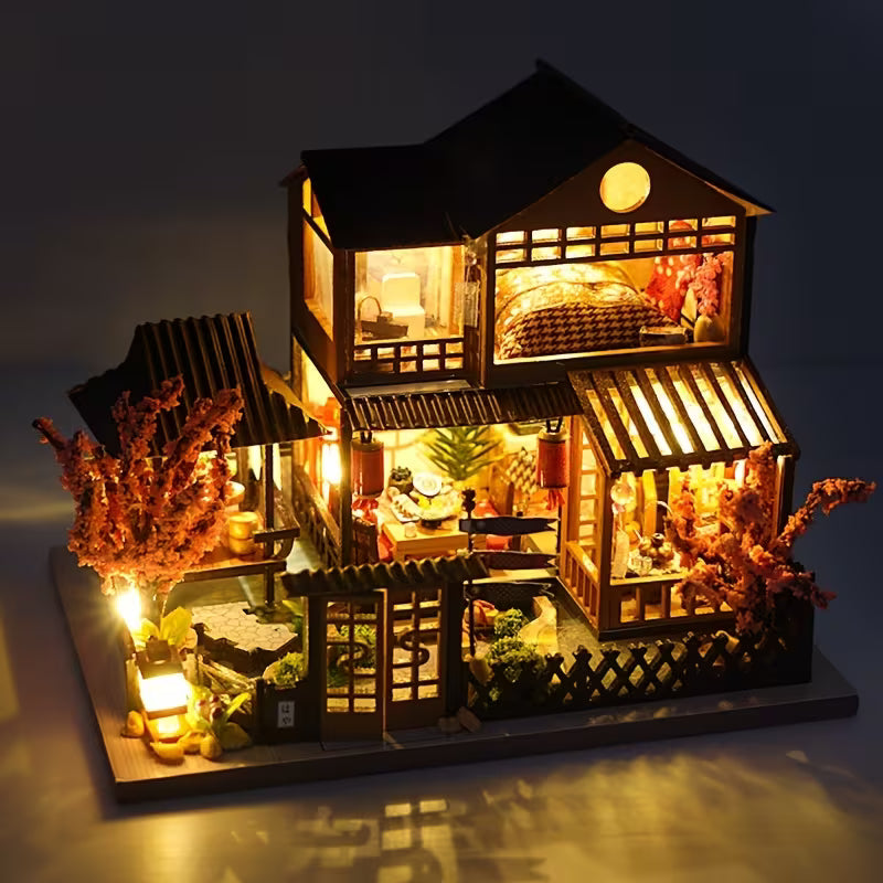 Fertiges beleuchtetes Miniaturhaus mit warmer LED-Beleuchtung
